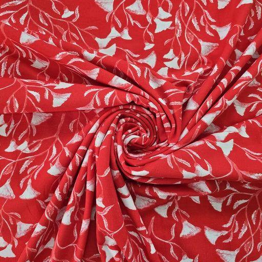 baumwolljersey-mit-weiss-rotem-blumenmuster-auf-leuchtend-rotem-hintergrund-stilisiertes-design-mit-glockenblumen-ähnlichen-blüten-stoffe-stoffpilz
