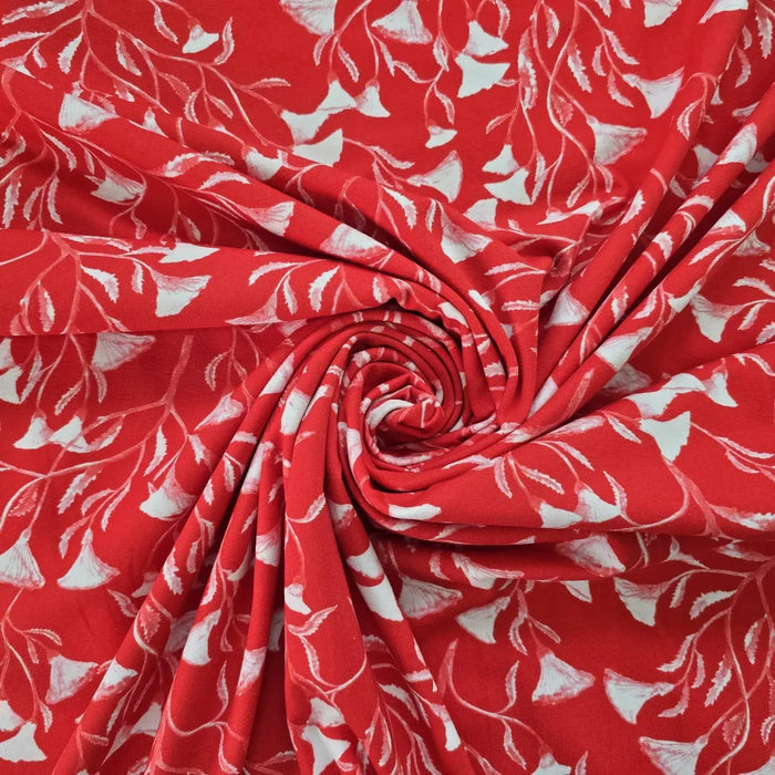 baumwolljersey-mit-weiss-rotem-blumenmuster-auf-leuchtend-rotem-hintergrund-stilisiertes-design-mit-glockenblumen-ähnlichen-blüten-stoffe-stoffpilz