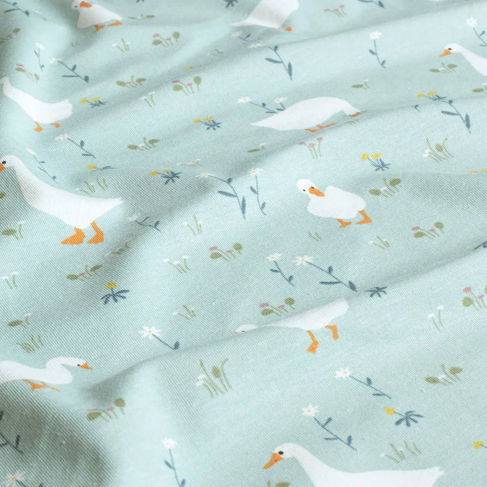 hellblau-enten-blumen-trikot-muster-stoff-stoffpilz